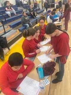 Students teams working together to win the Battle of the Books