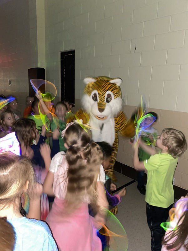 Rory the Tiger mascot joined in on the glow party fun dancing with students around